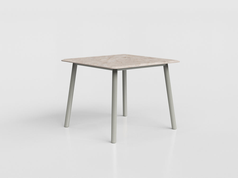 Boss square compact dining table with marble top and gray aluminum base, designed by Luciano Mandelli